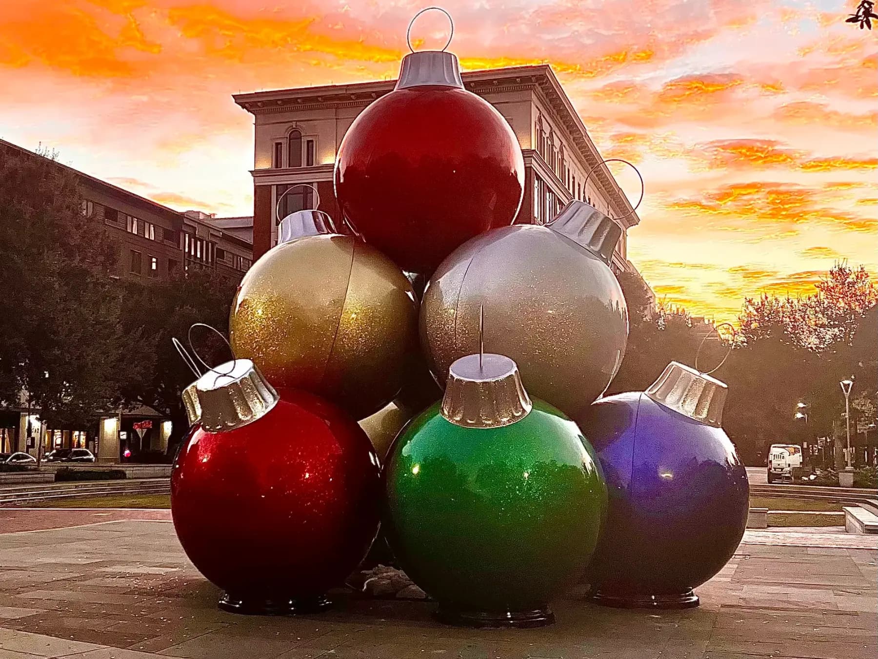 Oversized commercial Christmas ornament display on a plaza