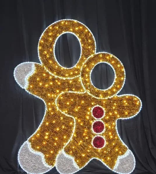 Illuminated gingerbread figures set up as a walk-through holiday photo opportunity