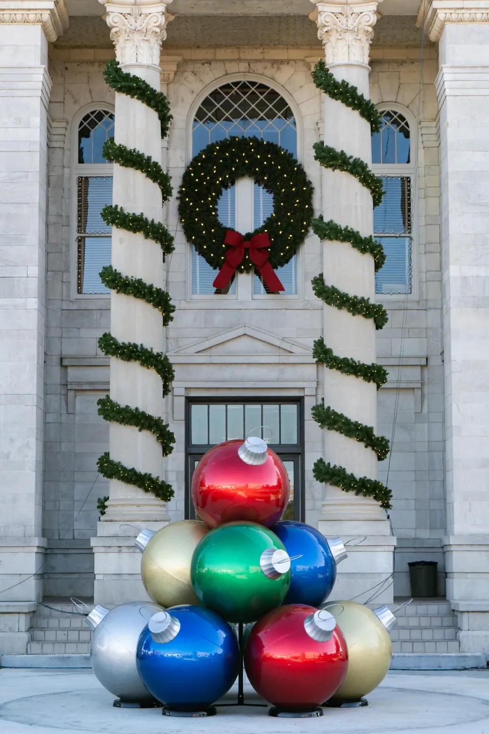 Oversized commercial Christmas ornament display on a plaza